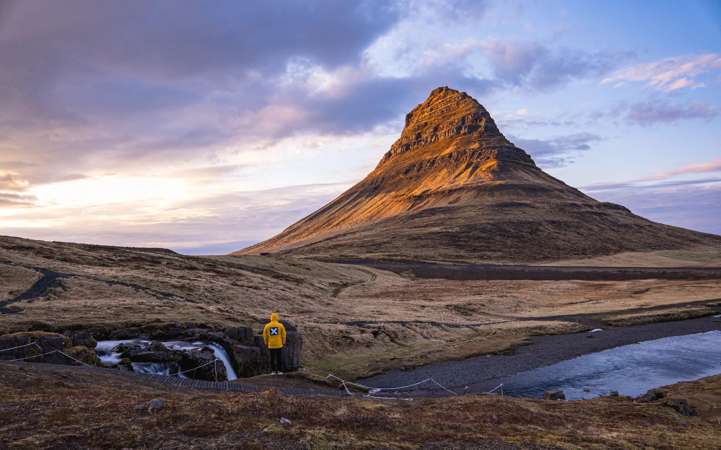 Kirkjufell mountain beneath a colourful sunset in Iceland
