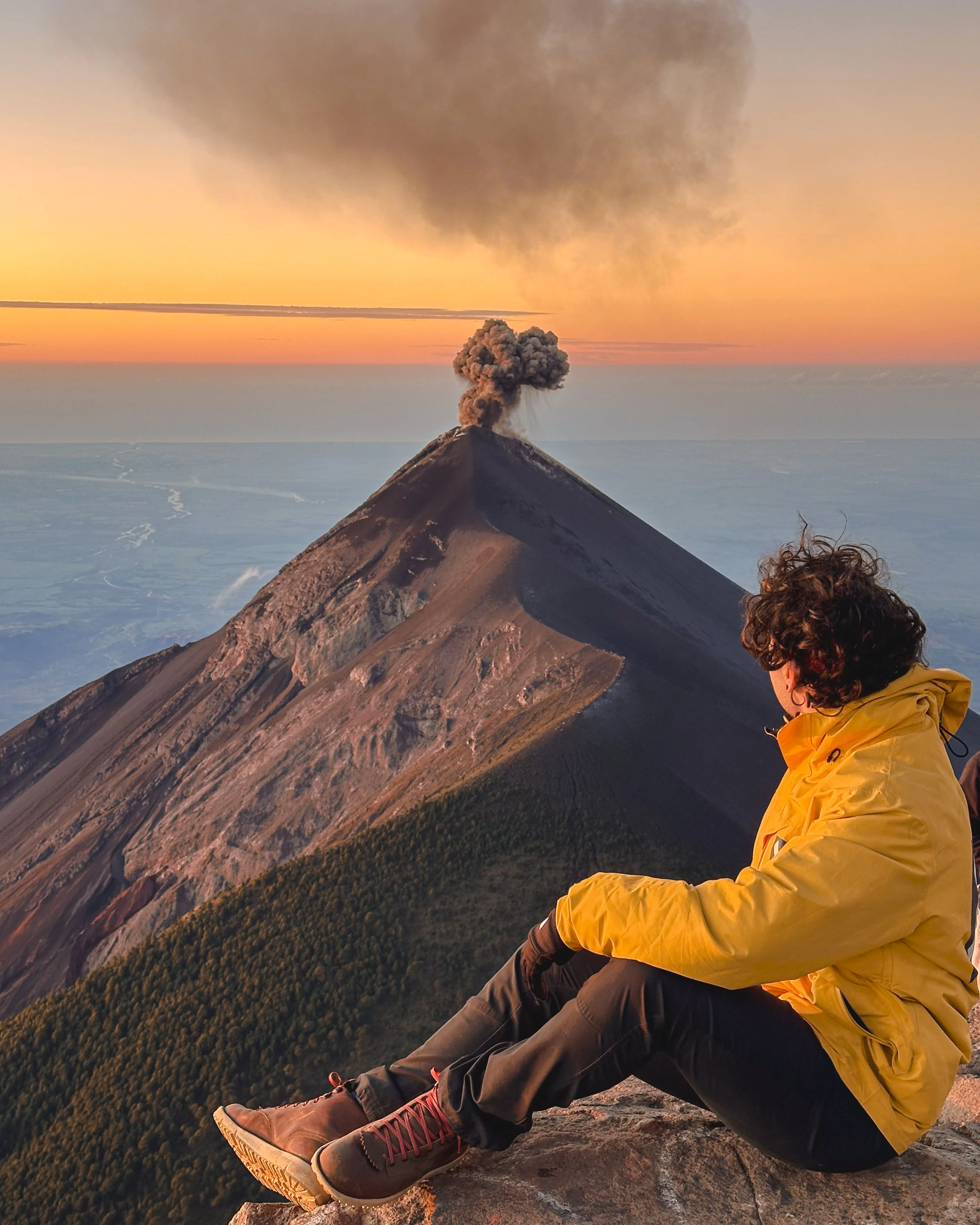 Javi watching Volcán de Fuego erupt at sunrise in Guatemala